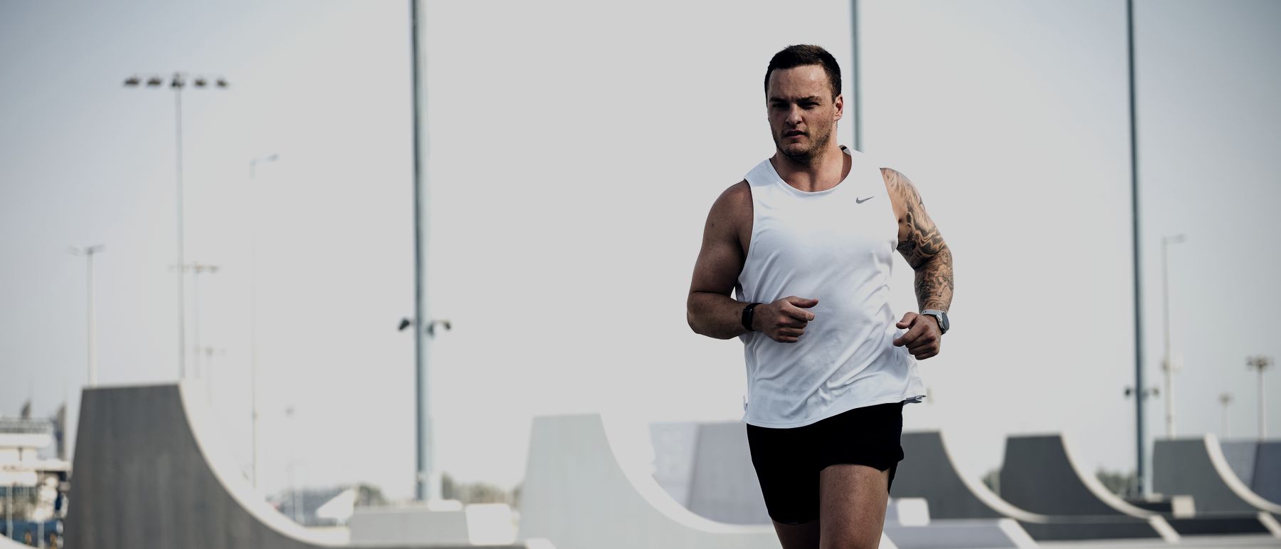 Running towards the camera on an empty track
